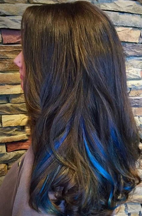 The ends are lightened to a golden caramel color,. . Blue highlights with brown hair